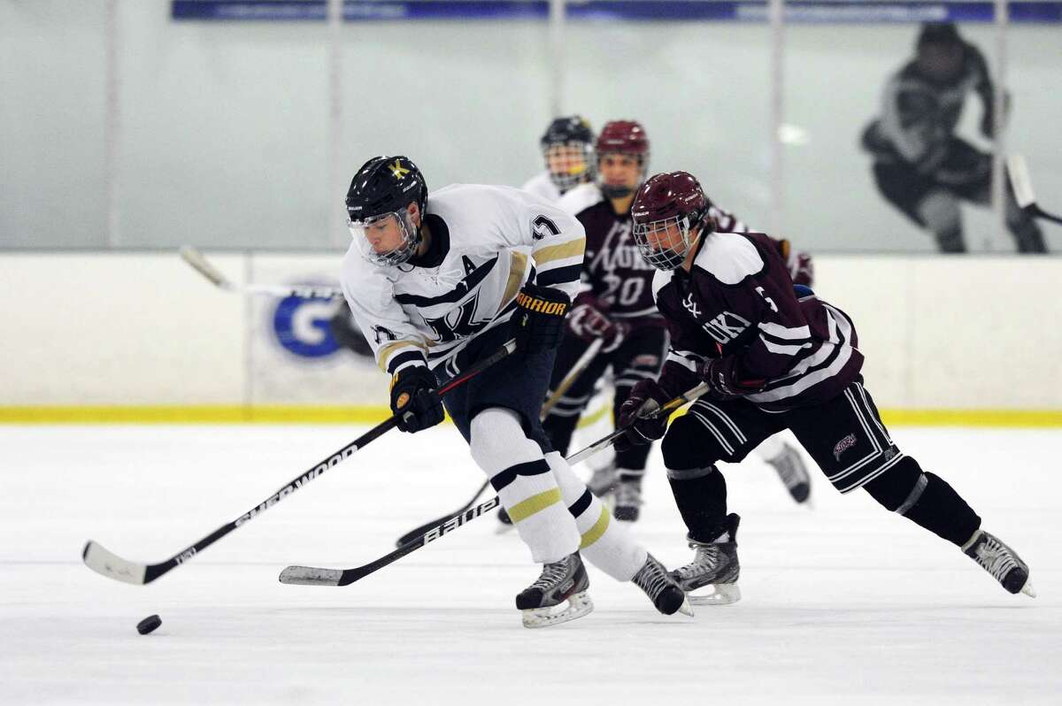 Richard Focke, of King School, outpaces David Ball, of St. Luke's, during the boys varsity hockey game at the SoNo Ice House in Norwalk, Conn. on Monday, Jan. 30, 2017.