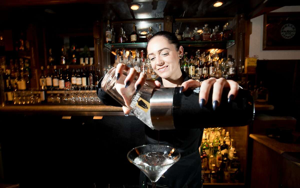 Moriah Wall makes a martini at Stanley's Steakhouse in Jackson, Calif., on Sunday, Jan. 29, 2017.