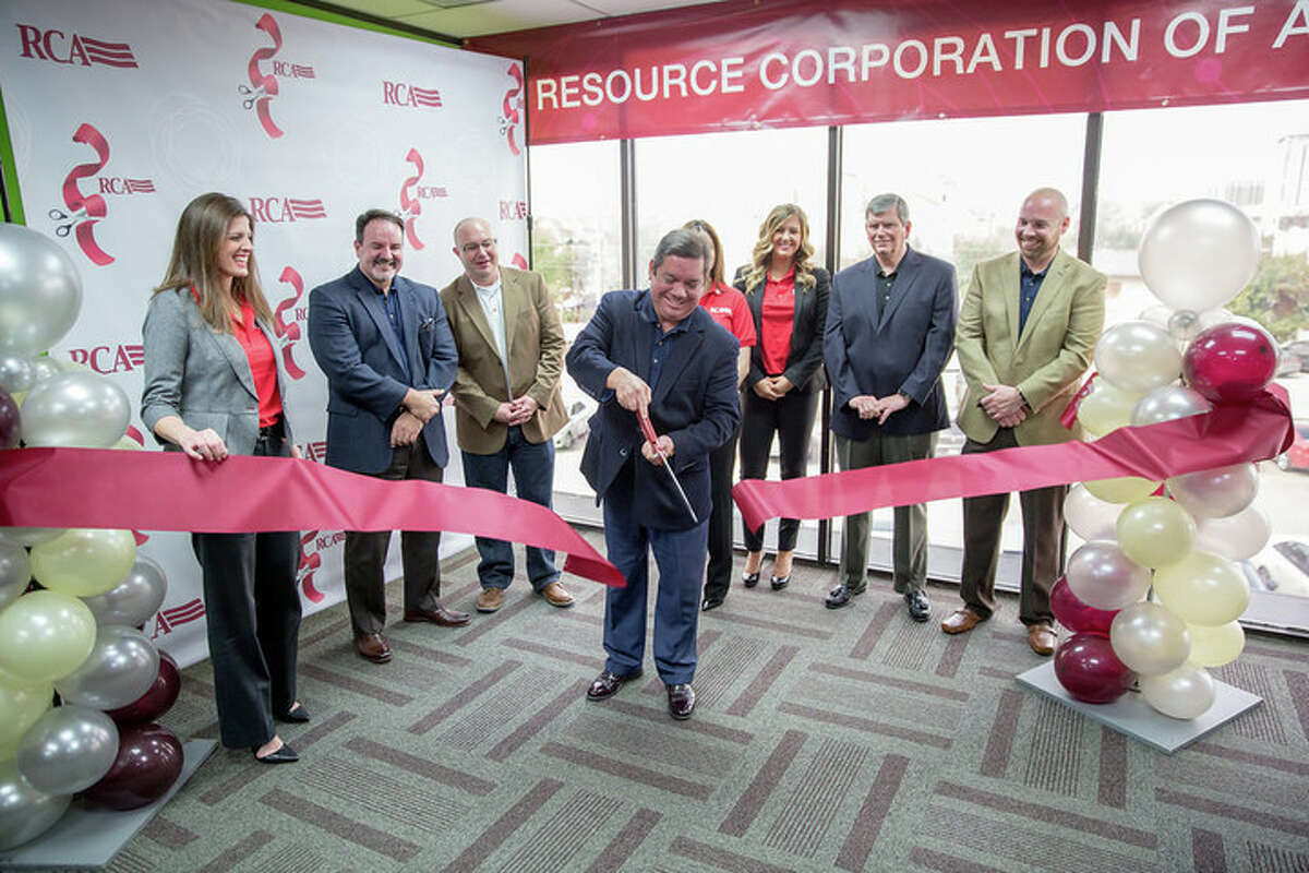 Officials with Resource Corp. of America cut the ribbon on their newly expanded Houston regional office. (Contributed photo)