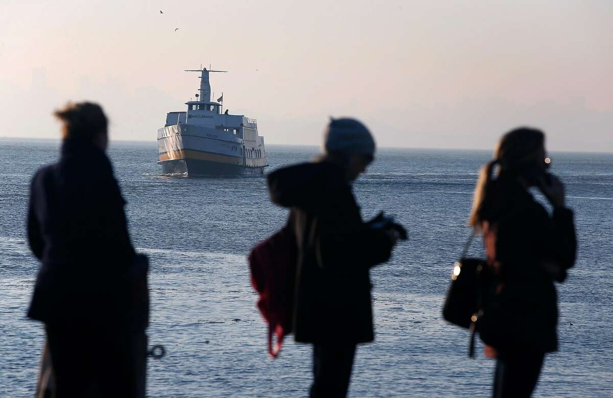 Commuters wait in line to board the Blue & Gold Fleet's Royal Star ferry as it arrives at Zelinsky Landing in Tiburon, Calif. on Tuesday, Jan. 31, 2017. Golden Gate Ferry was scheduled to take over the Tiburon to San Francisco morning and afternoon commuter routes from the Blue & Gold Fleet this week but safety concerns raised by the Angel Island Tiburon Ferry Company, which also uses the same marina, has delayed the transition.