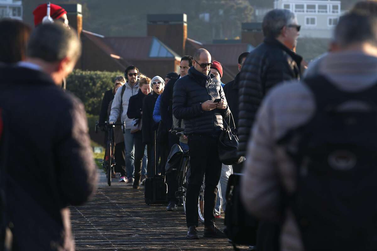 Commuters in line wait to board the Blue & Gold Fleet's Royal Star ferry at Zelinsky Landing in Tiburon, Calif. on Tuesday, Jan. 31, 2017. Golden Gate Ferry was scheduled to take over the Tiburon to San Francisco morning and afternoon commuter routes from the Blue & Gold Fleet this week but safety concerns raised by the Angel Island Tiburon Ferry Company, which also uses the same marina, has delayed the transition.