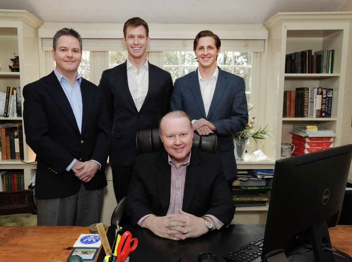 The Hunt Scanlon Media executive team from left standing, Scott Scanlon, Michael Wasulko, Chase Barbe and Christopher Hunt (seated) at the firm's headquarters in Greenwich, Conn., Friday, Jan. 27, 2017. Hunt Scanlon Media, founded in 1988 by Christopher Hunt and Scott Scanlon, is a trade publisher and market research firm covering the global executive search and human capital industries.