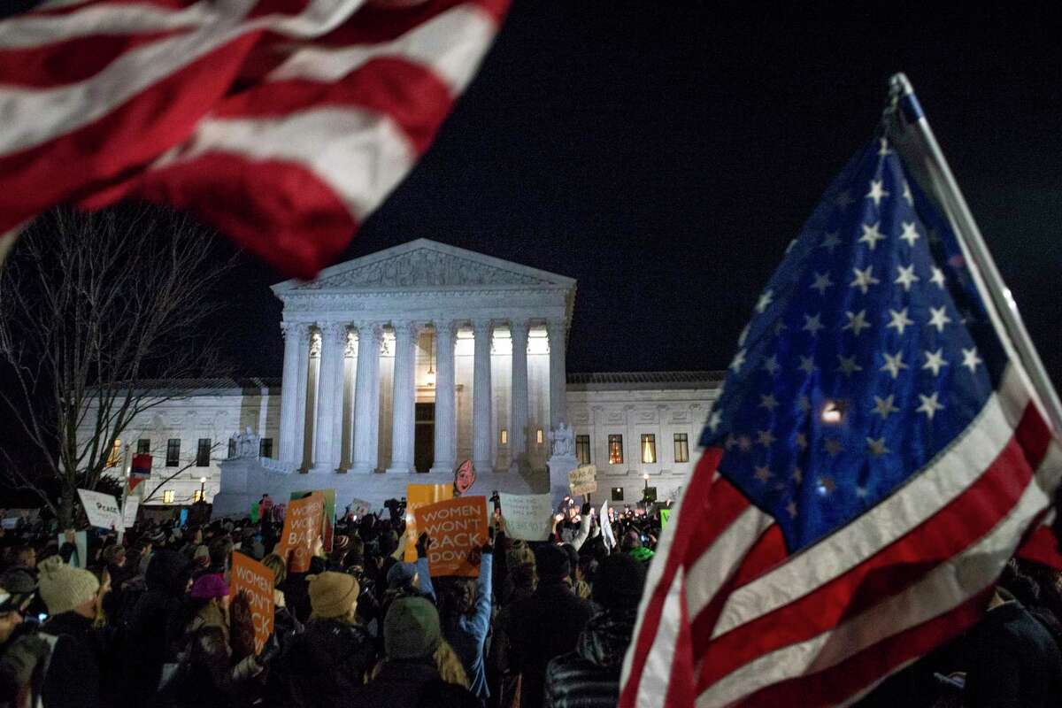 Protesters gather at a rally against President TrumpÂs executive order banning entry to refugees and others from seven Muslim-majority countries, at the Supreme Court in Washington, Jan. 30, 2017. (Gabriella Demczuk/The New York Times)