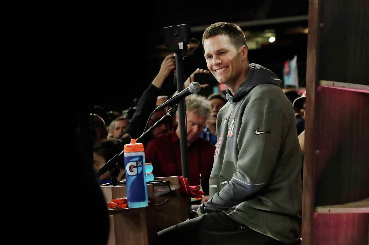 Tom Brady of the New England Patriots reacts as he speaks with the media during Super Bowl LI Opening Night at Minute Maid Park on Jan. 30, 2017 in Houston.