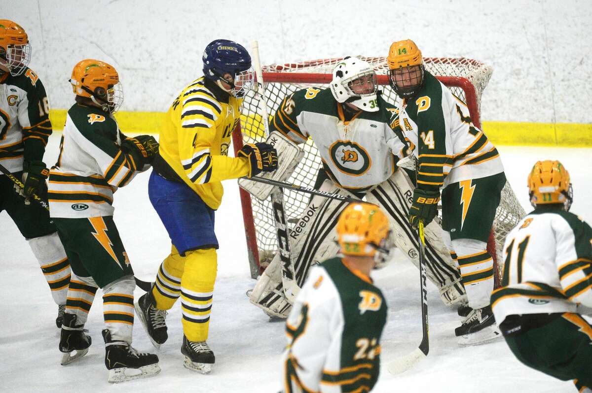 Dow's Jeremy Slasor tends goal on Tuesday at the Midland Civic Arena.