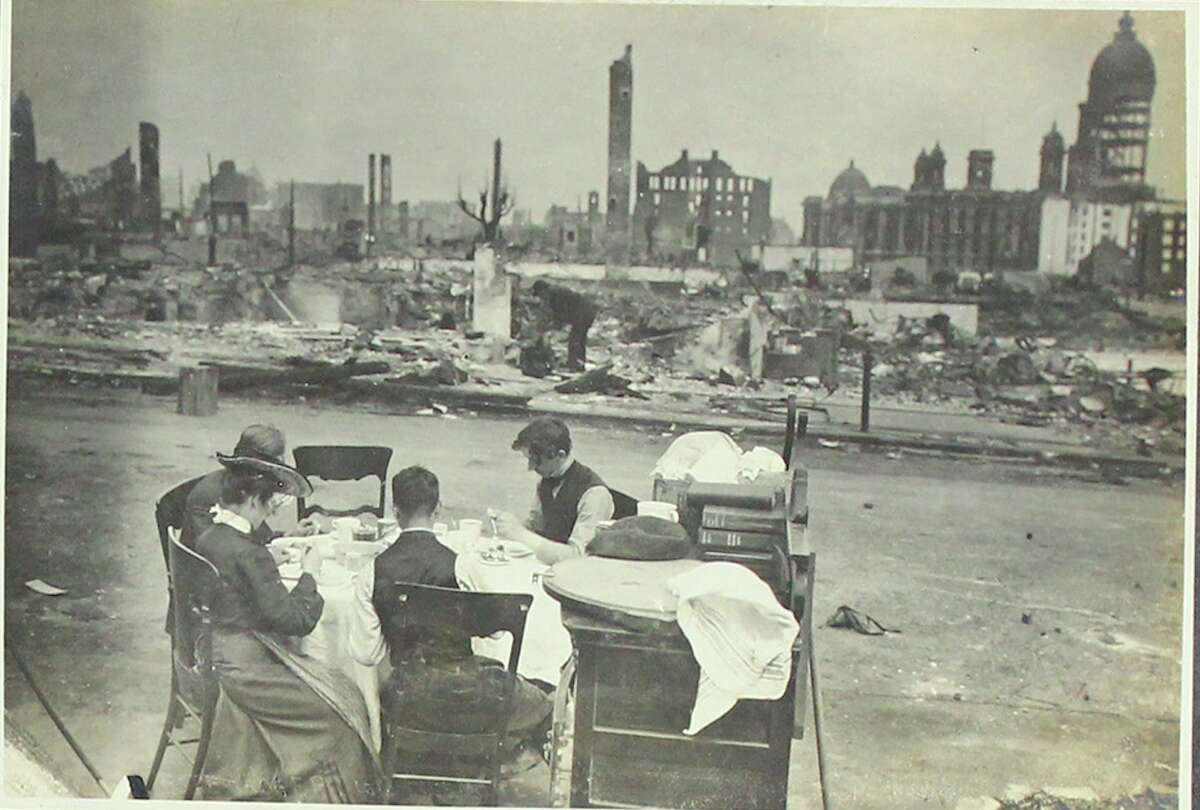 Survivors of the 1906 earthquake and fire sit amongst the rubble with their remaining belongings. The album of photos being auctioned by Swann Auction Galleries is estimated to go for $4,000 to $6,000.