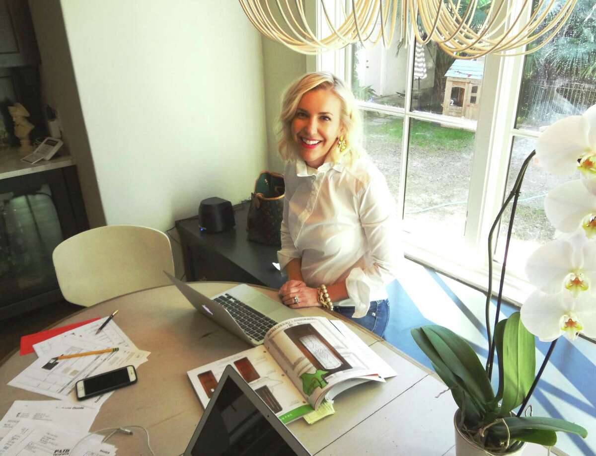 SCHONES: Interior designer Whitney Schones works at her kitchen table in her Olmos Park home.