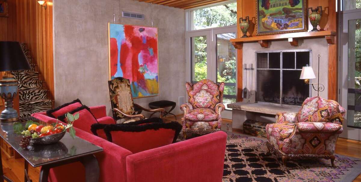 BAXTER: Debbie Baxter designed this bold, colorful living room accented by Latin American art in a family home.