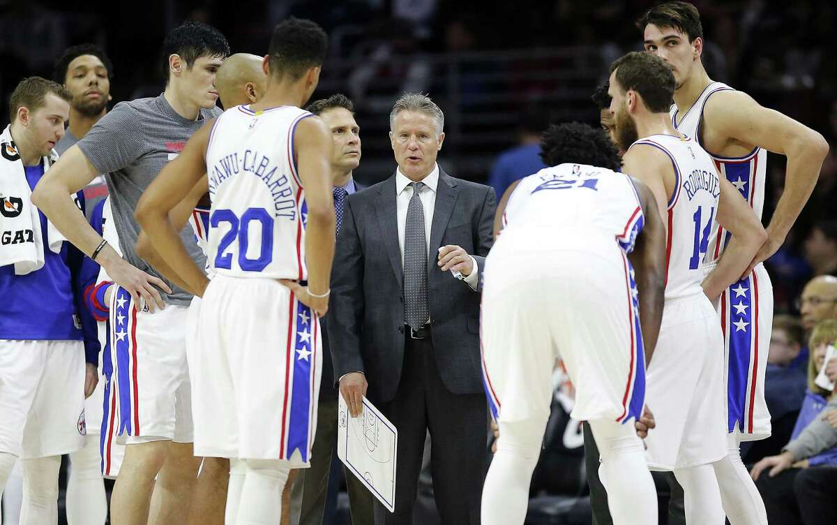 76ers coach Brett Brown gathers his team during the fourth quarter against the Portland Trail Blazers on Jan. 20, 2017, at the Wells Fargo Center in Philadelphia.