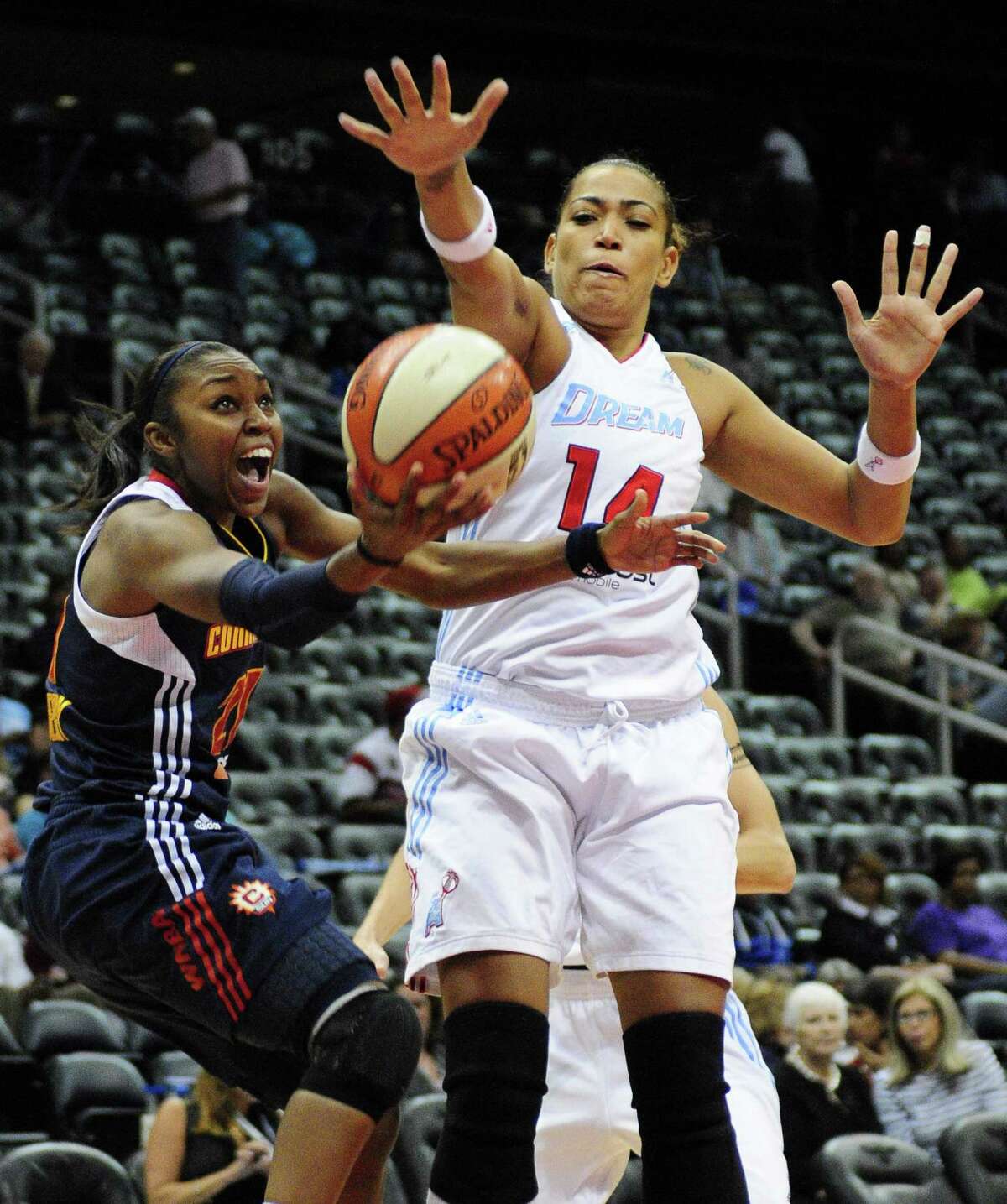 Connecticut guard Sun Renee Montgomery (21) goes up for a shot around the Dream’s Erika de Souza on Sept. 6, 2011 at Philips Arena in Atlanta.