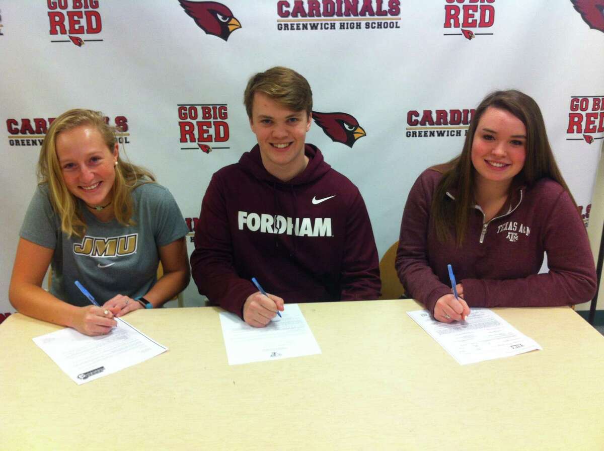 From left to right, Greenwich High School seniors Emma Barefoot, Paul Williams and Lindsay Schauder each signed National Letters of Intent to play sports at Division I schools Wednesday at Greenwich High School?’s media center. Barefoot will play soccer at James Madison University, Williams will play football at Fordham University and Schauder will take her equestrian skills to Texas A&M. February 1, 2017