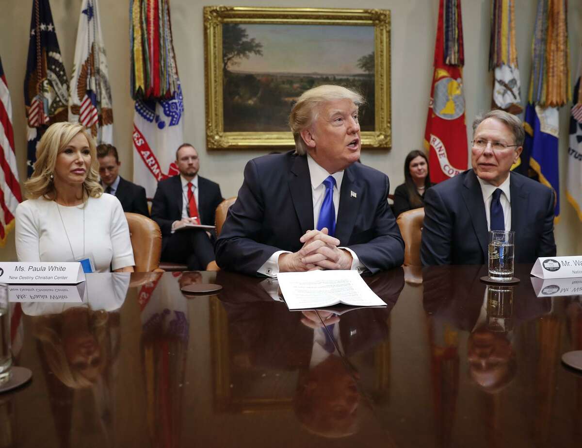 President Donald Trump discusses Supreme Court nominee Neil Gorsuch with National Rifle Associations Executive Vice President and Chief Executive Officer Wayne LaPierre, right, and Pastor Paula White ,of the New Destiny Christian Center, and others at the White House on Wednesday.