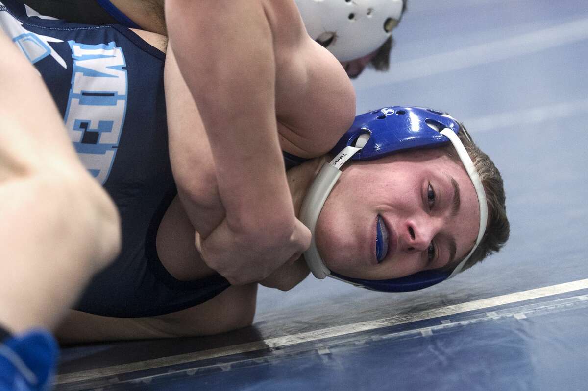 Meridian's Matt Person wrestles in his 140-pound match on Wednesday at Meridian High School.