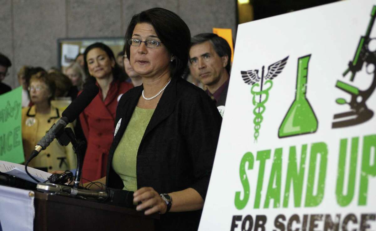 FILE PHOTO — Kathy Miller, Texas Freedom Network president, speaks during a news conference where a new science curriculum for Texas public schools was discussed Wednesday, Nov. 19, 2008, in Austin, Texas. She speaks as the State Board of Education prepares to take public testimony on proposed new standards that would encourage middle school students to discuss alternative explanations for evolution. (AP Photo/Harry Cabluck)