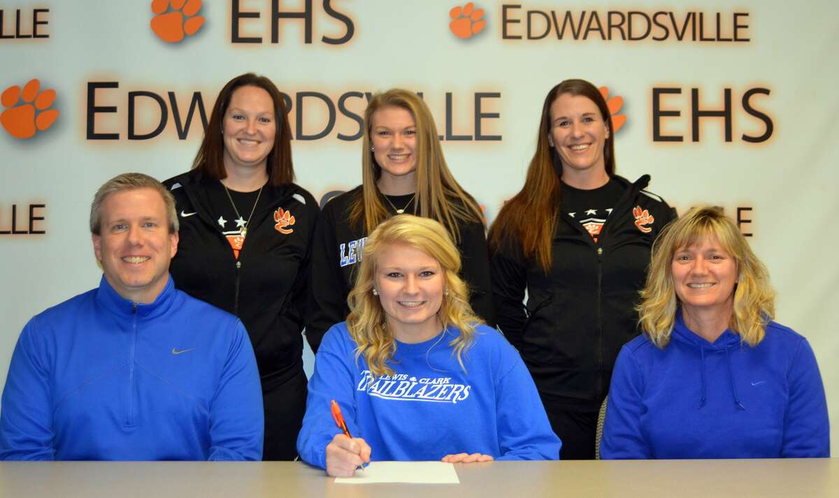 EHS senior Taylor Hansen, seated center, will play women's soccer at LCCC. Seated are her parents, Jeff, left, and Michelle. Standing from left to right are EHS coach Abby Comerford, sister Casey Hansen and EHS assistant coach Abby Federmann.