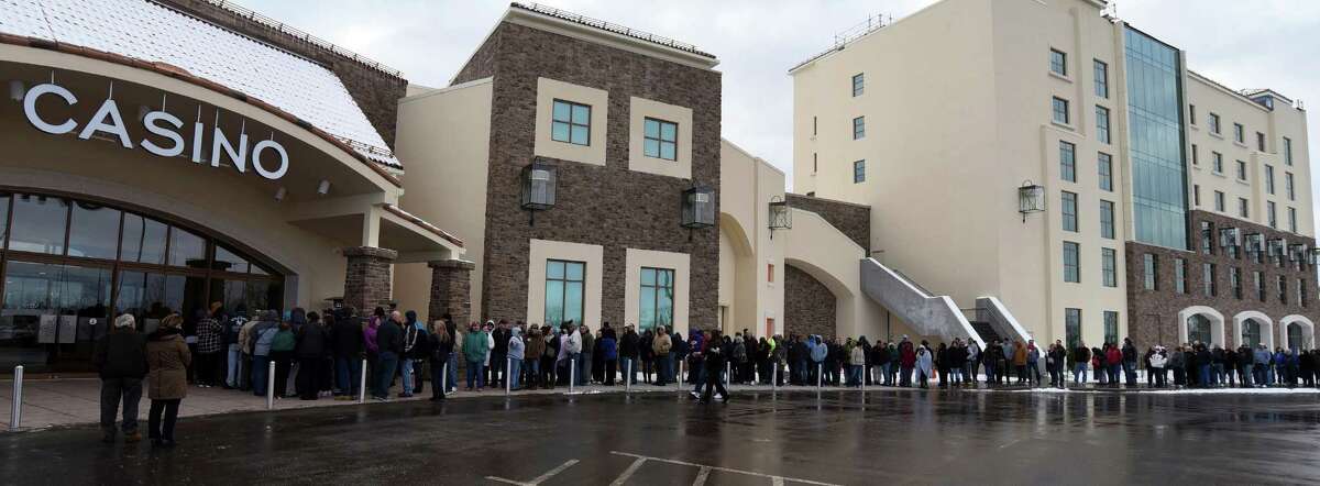People wait in line for the doors to open on opening day at del Lago Resort and Casino in Waterloo, N.Y., Wednesday, Feb. 1, 2017. Thousands of new slot machines and table games debuting this month as part of New York state's casino growth spurt are bringing not only more chances to gamble, but also millions of dollars more to help problem gamblers. (Kevin Rivoli/The Citizen via AP) ORG XMIT: NYAUB102