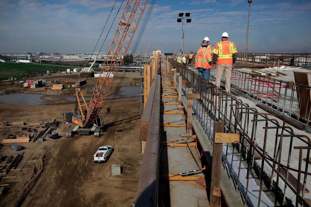 Workers on an elevated section of tracks for the high-speed rail system in Fresno, Ca., as seen on Wednesday Feb. 1, 2017.