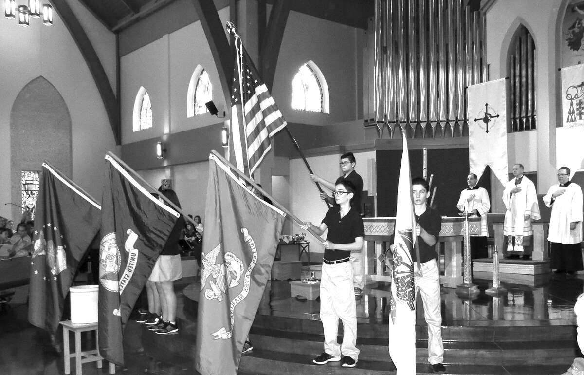 As part of a ceremony honoring veterans, students presented a color guard. Bishop Thomas Paprocki attended the event. Both St. Boniface and Father McGivney High School students participated in the ceremony, which followed a mass celebrating Catholic Schools Week.