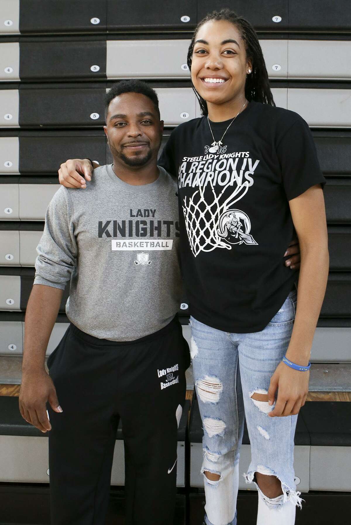 Steele girls basketball coach Jeffery Chatman and senior Antonia Anderson pose in the school’s gym on June 30, 2016.