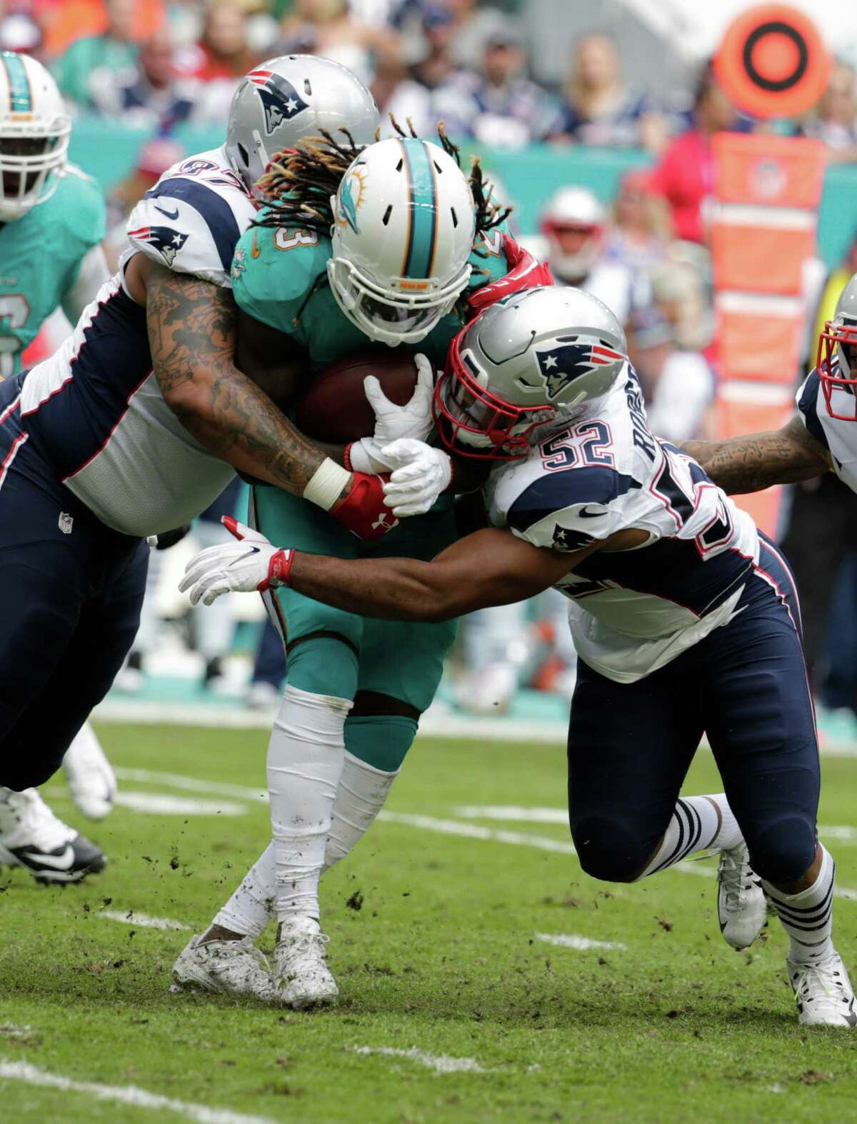 Miami Dolphins middle linebacker Elandon Roberts (52) walks the