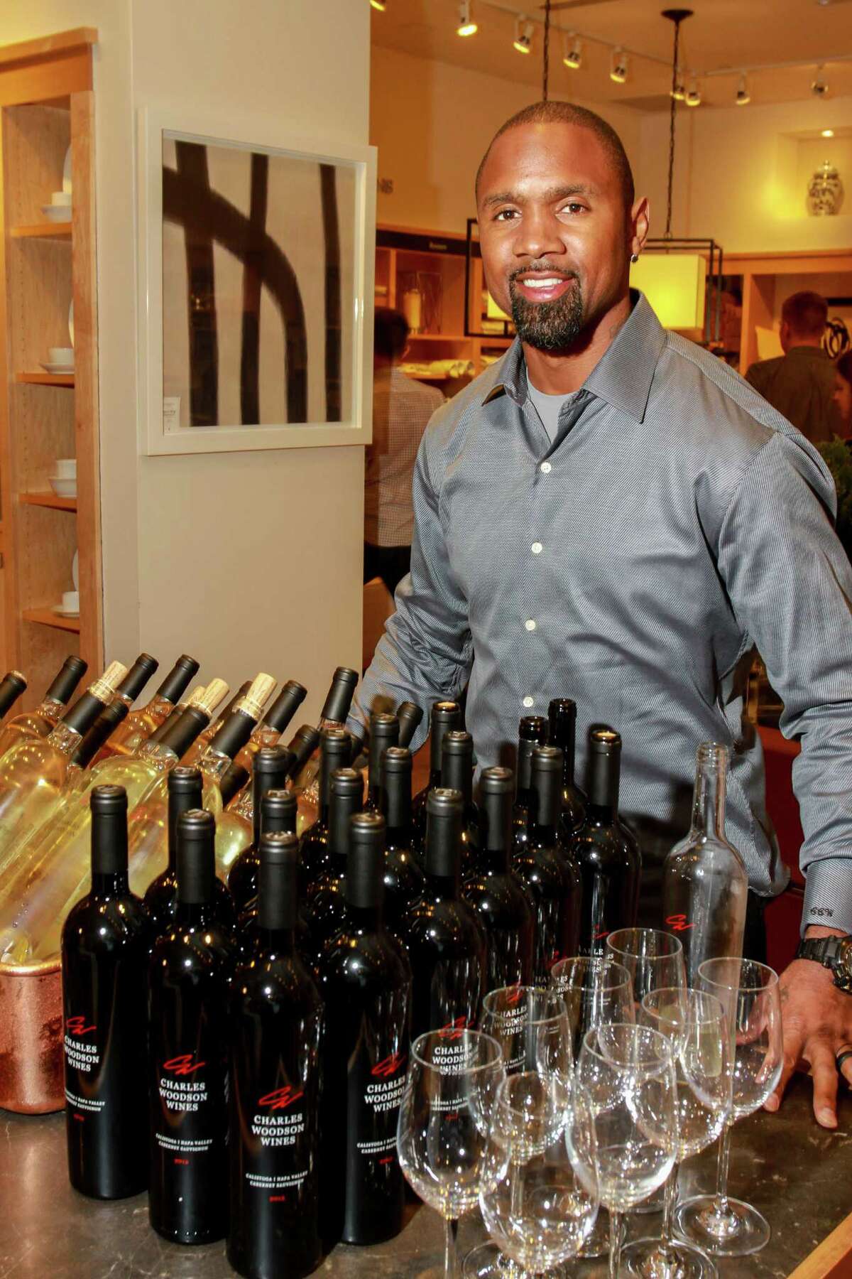Charles Woodson with a display of his wine at Williams Sonoma. Woodson's wines were served at the Culinary Cookoff.