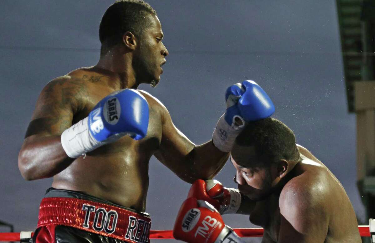 San Antonio’s Tyrell Herndon (left) punches Jerome Aiken during a pro boxing match at Wolf Stadium on Nov. 14, 2015.
