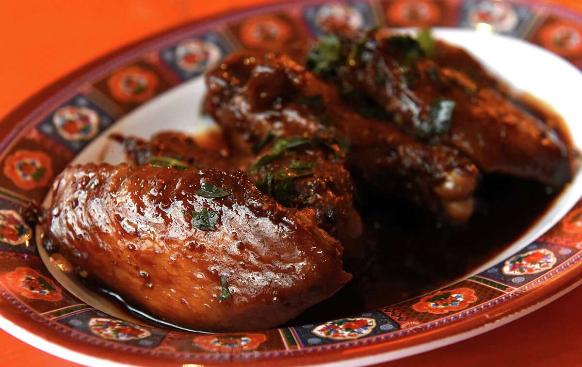 Fish and soy sauce glazed chicken wings with fried curry leaf at BackBar at 347 Warren St. on Thursday, Jan. 26, 2017 in Hudson, N.Y. (Lori Van Buren / Times Union)