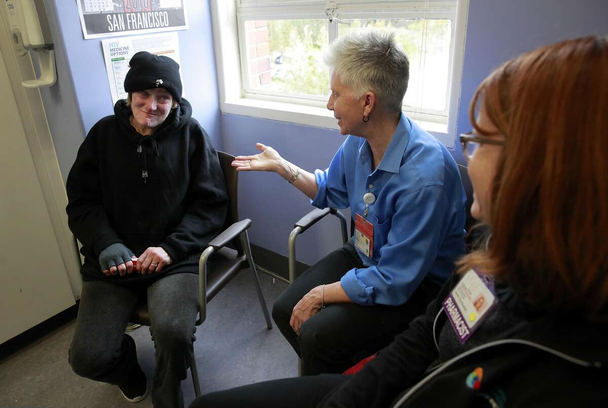 HIV patient Pamela Phelan, (left) meets with RN Valerie Robb, (center) and pharmacist Janet Grochowski during an appointment in San Francisco Ca. on Thursday Feb. 2, 2017. San Francisco General Hospital�s long-time HIV ward has made a remarkable new addition: a geriatric clinic called Golden Compass. As Ward 86 patients grow older the clinic will address the needs of an aging AIDS population.