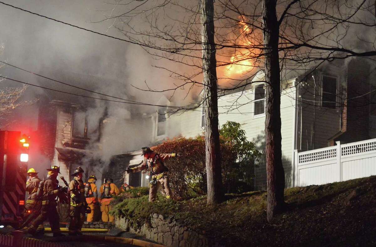 Wilton firefighters respond to a single-family house on fire on Shadow Lane Thursday evening in Wilton. The surrounding towns of Ridgefield, Georgetown, Norwalk, Weston New Canaan and Westport provided mutual aid and extra tanker trucks to battle the blaze. No injuries to the homeowners were reported, the house was a total loss.