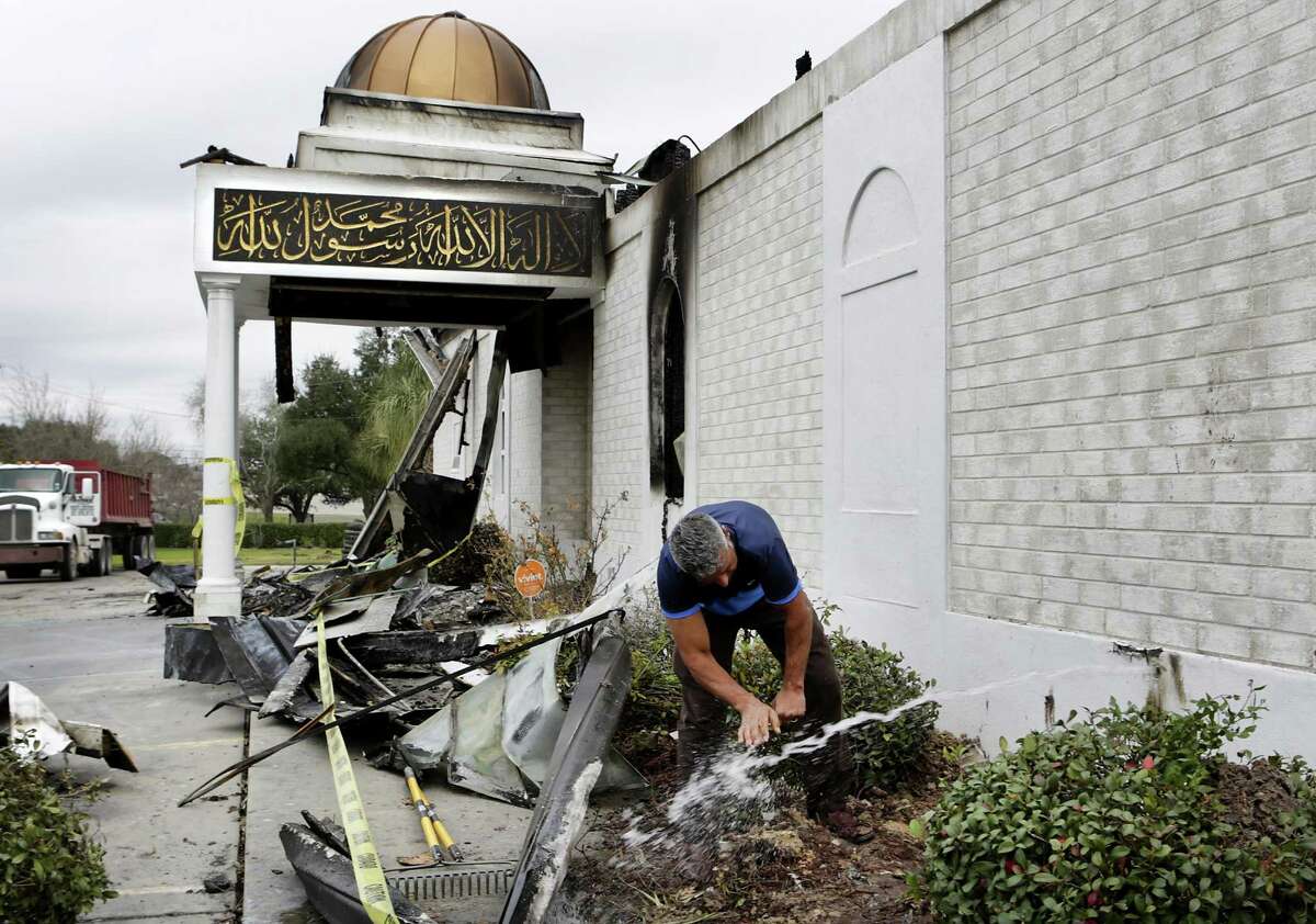 When a gush of water started flowing from a broken water line from the mosque, Shahid Hashmi, President of the Victoria Islamic Center rushed over to wash his hands before going to a prayer service on Tuesday, Feb. 2, 2017.