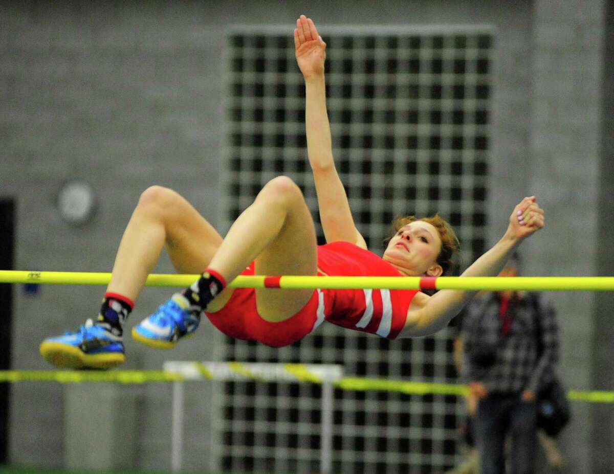 Greenwich's Olivia Dilascia clears 5'2" in the high jump event, during FCIAC track action in New Haven, Conn., on Thursday Feb. 2, 2017.