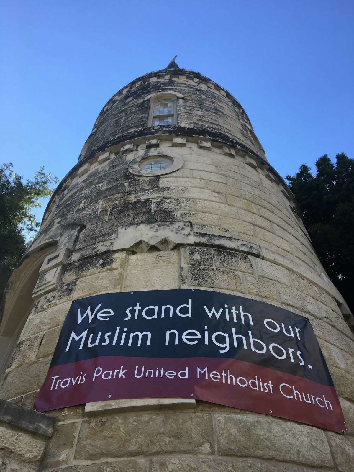 The tower of Travis Park United Methodist Church proclaims its support for Muslims in the midst of President Donald Trump executive order banning travel from seven predominantly Muslim countries