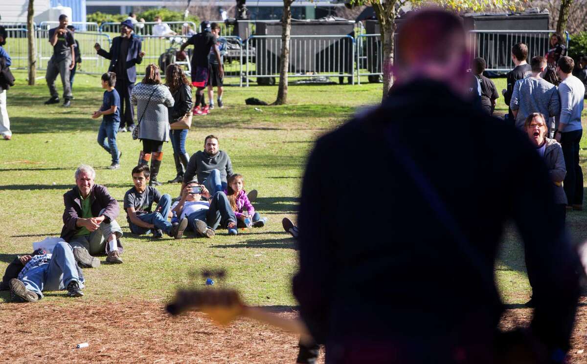 People listen to the music of Adam Bricks while visiting Super Bowl Live at Discovery Green on Saturday, Jan. 28, 2017, in Houston. ( Brett Coomer / Houston Chronicle )