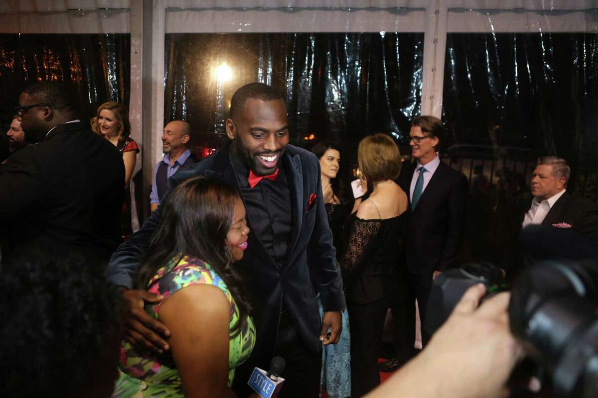 Houston Texans linebacker Whitney Mercilus works the red carpet at the Bulls and Blackjack celebrity poker tournament and casino night, a fundraiser for the Barbara Bush Houston Literacy Foundation, The Wade Smith Foundation and the WithMerci Foundation, in River Oaks, Thursday, Feb. 2, 2017, in Houston.