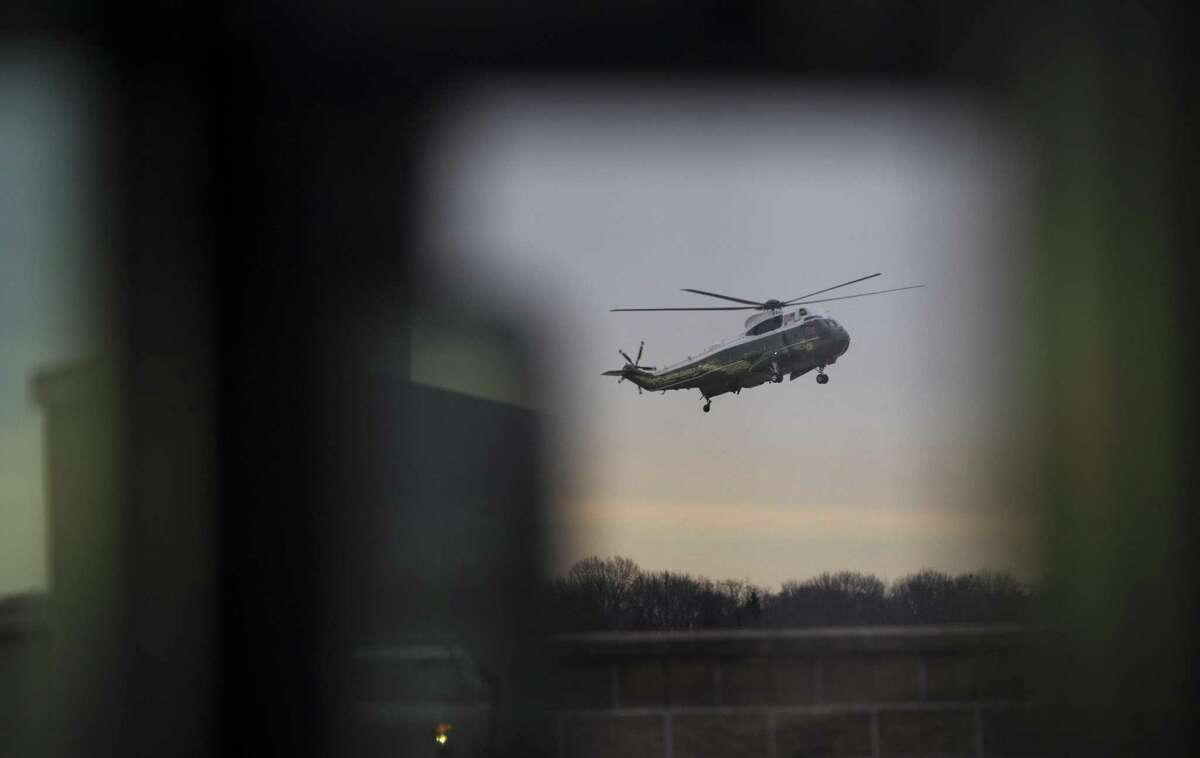 President Donald Trump arrives aboard Marine Force One to meet with the family of a Navy SEAL killed during a raid in Yemen, at Dover Air Force Base in Delaware, Feb. 1, 2017. The raid on al-Qaida militants was the first such operation ordered by Trump since he took office on Jan. 20. (Stephen Crowley/The New York Times)