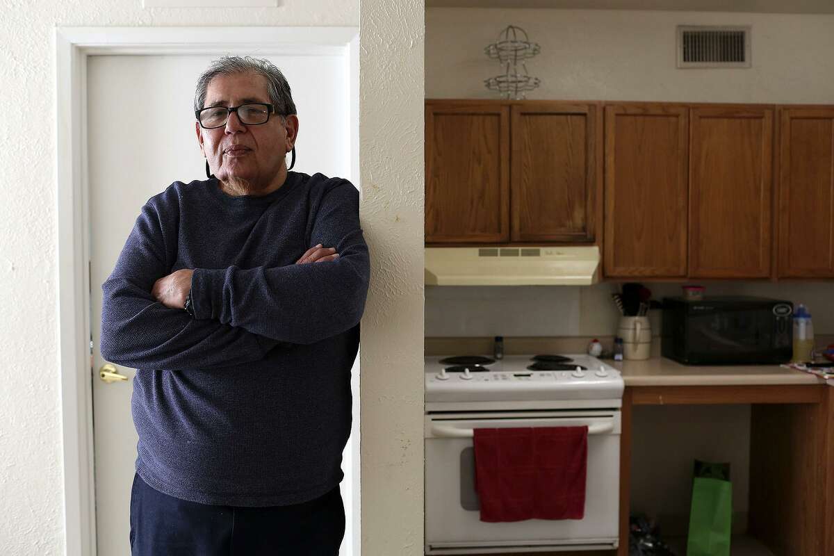Robert Gill stands in his apartment in San Antonio on Thursday, Jan. 21, 2015. After months in a halfway house, then living in a warehouse at his brother's business, Gill had settled into his own place. He had seen his life prison sentence for drug distribution conspiracy commuted by President Obama, but on Friday, he was back before a federal judge on another drug charge.
