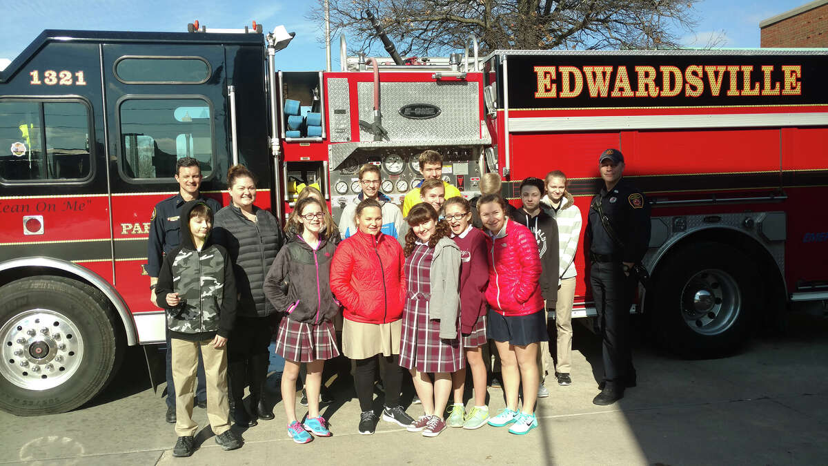 As part of Catholic Schools Week, students at St. Mary's drew pictures, wrote thank you notes and delivered cookies and treats to first responders. Students are pictured here with members of the Edwardsville Fire Department.