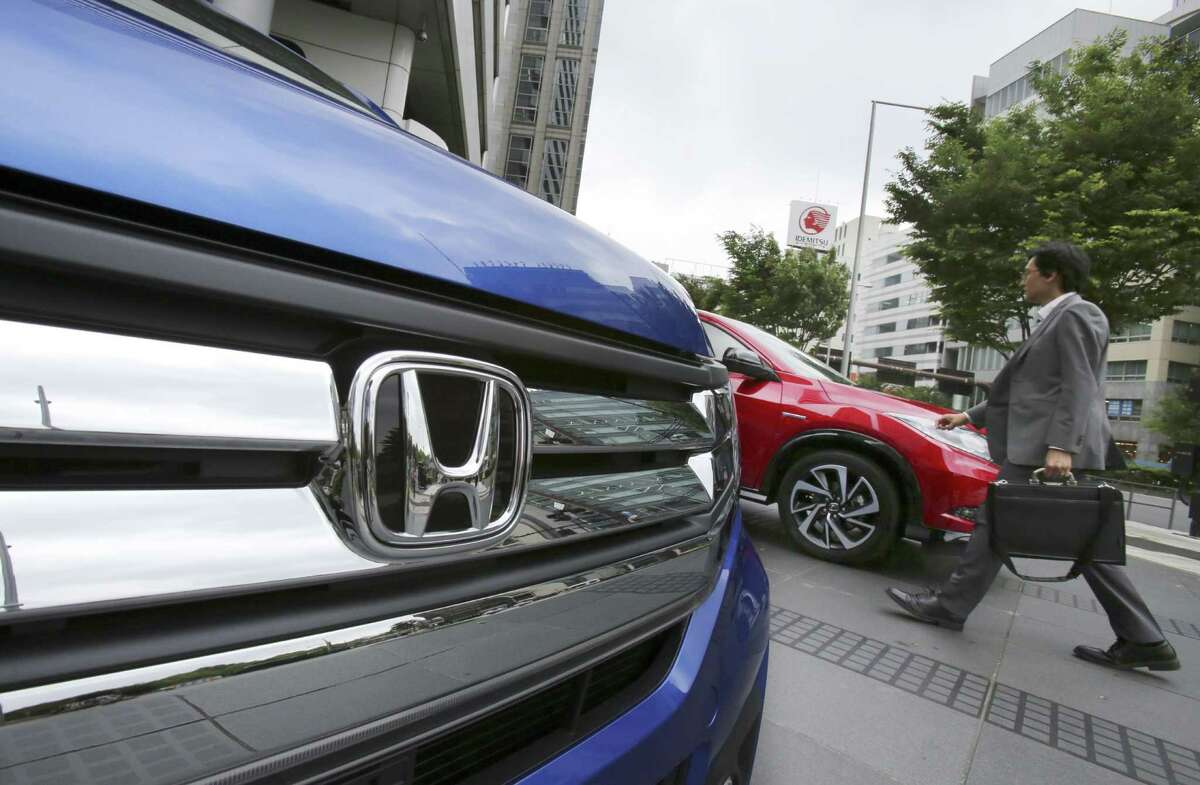 Honda says profit jumped 36 percent to $1.5 billion in the October-December quarter, shrugging off damage from a strong yen, and the Japanese automaker raised its annual forecast.