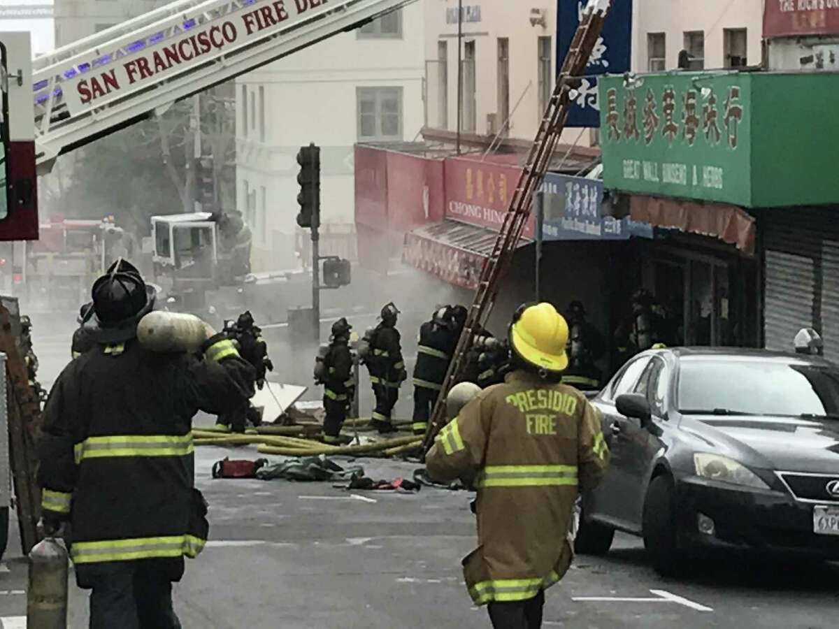 Smoke billows from a fire in San Francisco’s Chinatown Friday.