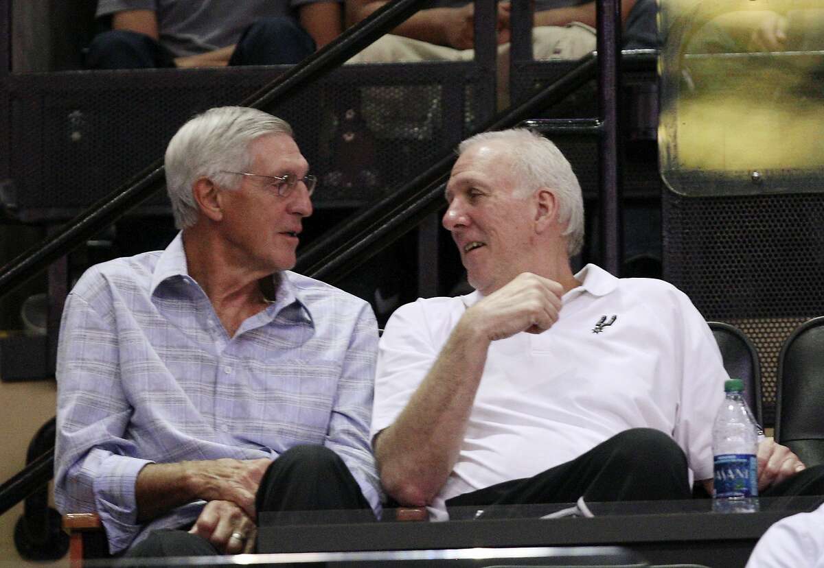 San Antonio Spurs Head Coach Gregg Popovich, right, talks with former Utah Jazz Head Coach Jerry Sloan during an intrsquad scrimmage at the AT&T Center, Wednesday, Oct. 3, 2012.