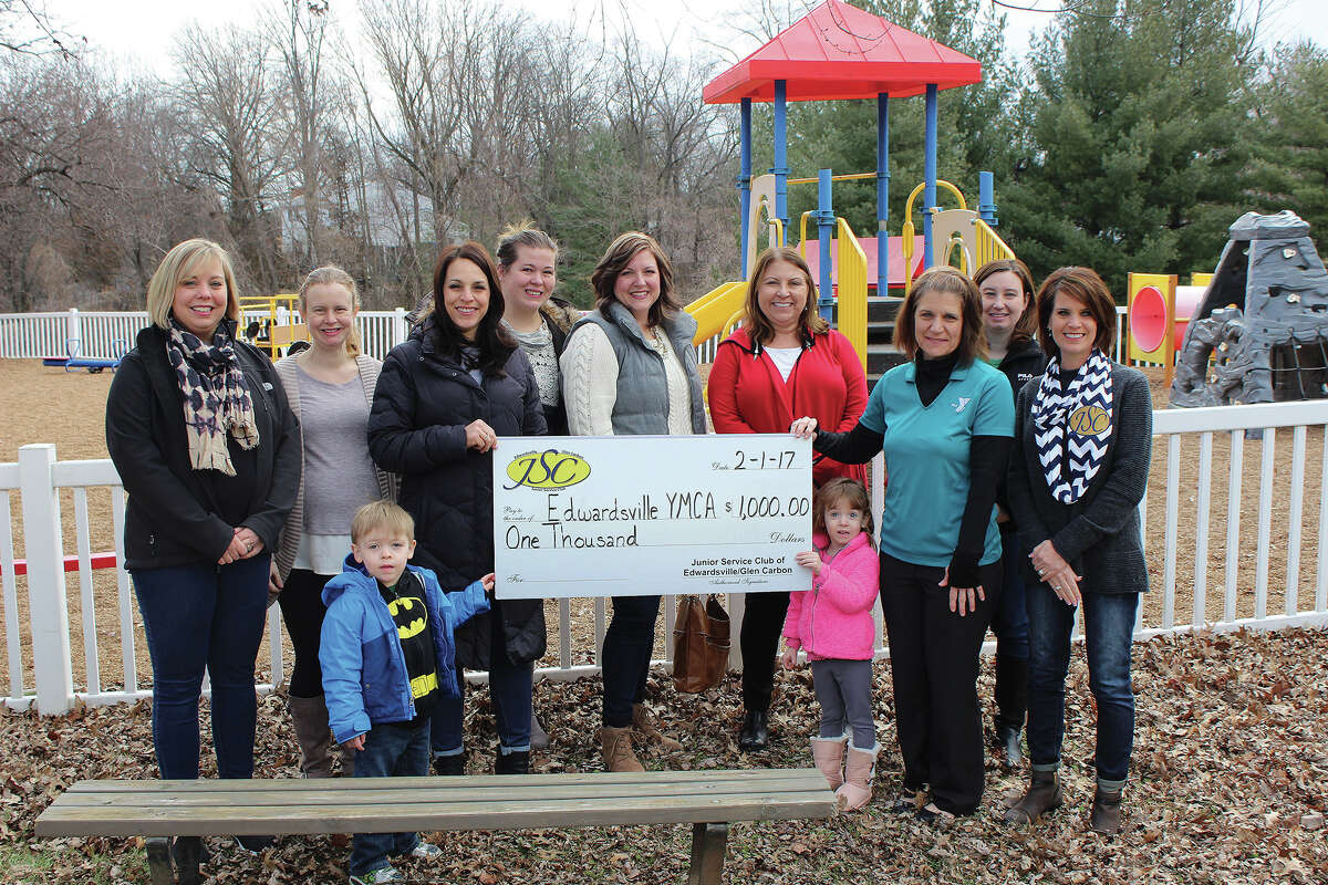 Ed/Glen Junior Service Club members pose with YMCA’s Karen Lintz, third from right, after awarding a $1,000 donation. The funds will go toward playground improvements to benefit both YMCA patrons and the community.