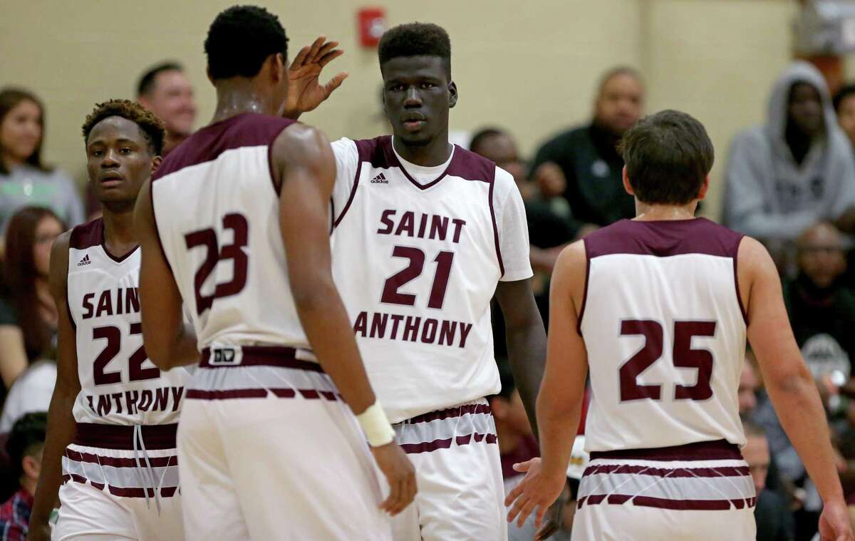 St. Anthony’s Obi Prosper (from left), Charles Bassey, Ousmane Ndim and Ricardo Valadez huddle during their game with Southwest Christian on Jan. 21, 2017 at Athlos Academy in San Antonio.