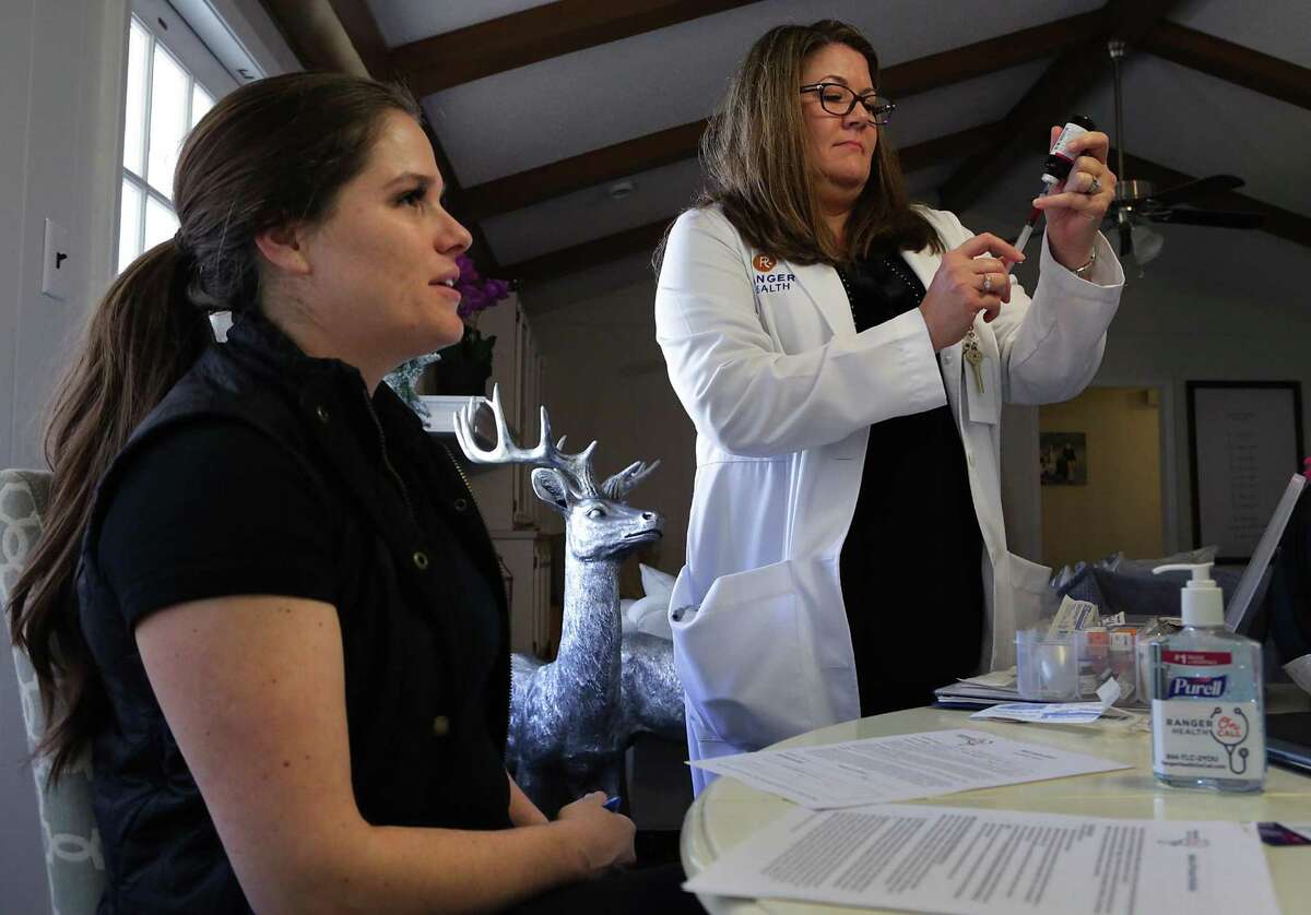 Tasha Despault, a PA, Physician Assistant, with Ranger Health, prepares an injection of B-12 for Amy Cornwell during a house call on Wednesday, Feb. 1, 2017.