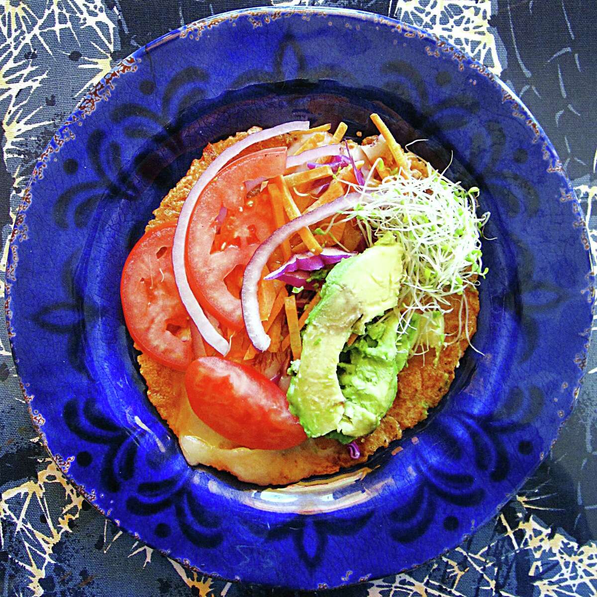 A veggie taco on a handmade red masa tortilla from Adelante.