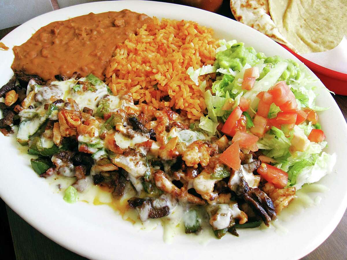 The Alambre Plate at Papa Gayos comes with grilled beef and chicken with bacon, cheese and pico with rice and beans and two tortillas.