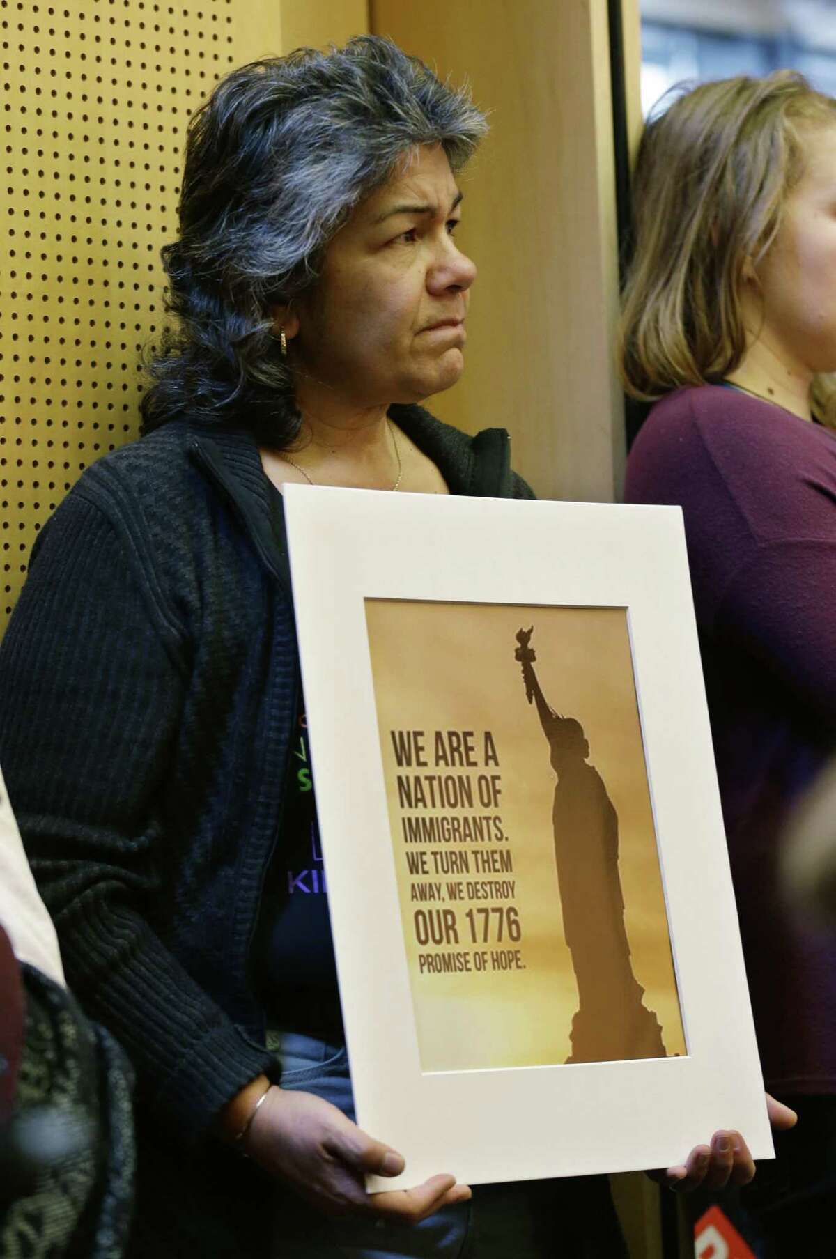 Sara Lopez attends a meeting in which the Seattle City Council reaffirmed that the city treats residents equally regardless of their refugee or immigration status. But nowhere is it written that the United States can never tap the brakes on immigration.