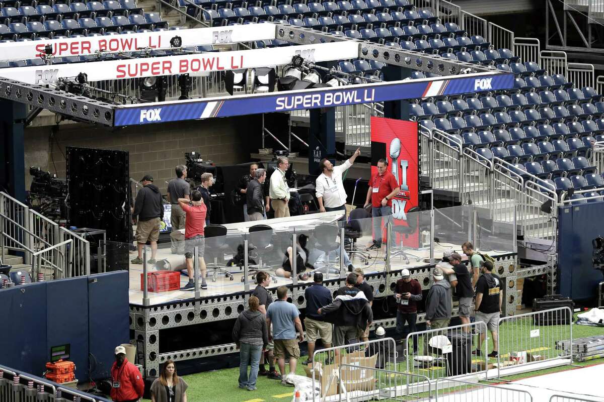 NRG Stadium is prepared for Sunday’s NFL Super Bowl LI. The Super Bowl is “an event that’s evolved into the definitive corporate deal-making showcase,” said Rick Horrow, a Harvard Law School expert on sports business.