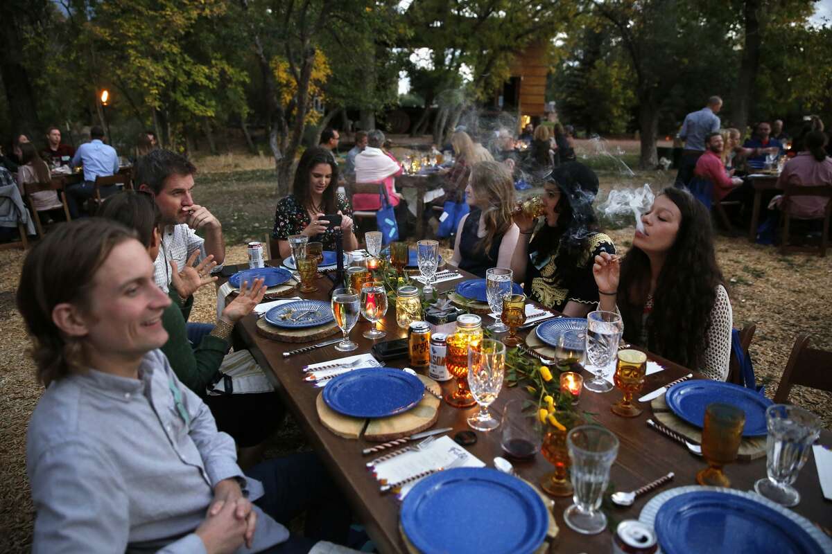 Diners smoke marijuana as they eat dishes prepared by chefs at Planet Bluegrass, an outdoor venue in Lyons, Colo.