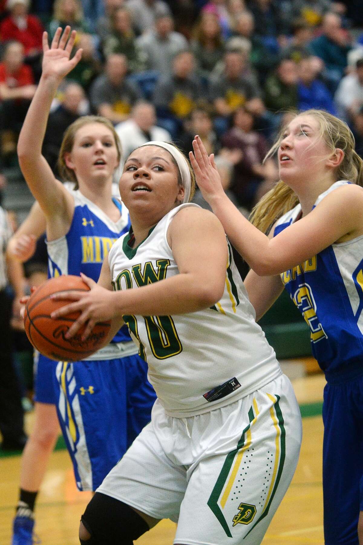 Dow's Asjia Blanton eyes the basket on Friday at H. H. Dow High School.