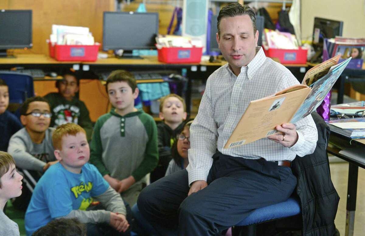 State Senator and Majority leader Bob Duff reads to students at Fox Run Elementary School as part of the Norwalk Reads program Friday, Feb. 26, in Norwalk.
